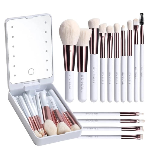 Makeup brush set with various bristle types and handles in a white case on a white background